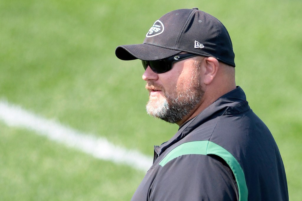 Jets general manager Joe Douglas looks on during practice