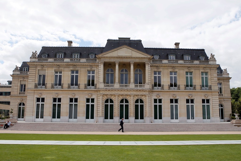 The Organisation for Economic Co-operation and Development (OECD) headquarters is pictured in Paris, France. Nearly 140 countries have agreed on a tentative deal that would make sweeping changes to how big, multinational companies are taxed in order to deter them from stashing their profits in offshore tax havens where they pay little or no tax. The agreement announced Friday foresees countries enacting a global minimum corporate tax of 15% on the biggest, internationally active companies.