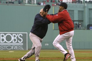 Yankees bench coach Don Zimmer is thrown to the ground by Boston starter Pedro Martinez