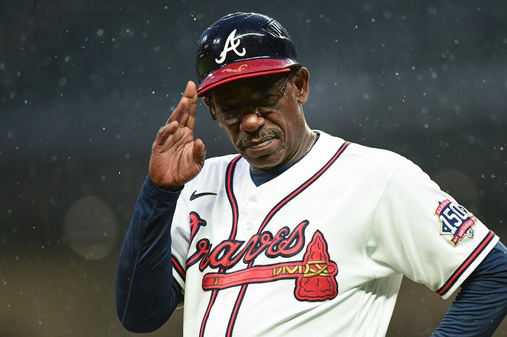 Ron Washington #37 of the Atlanta Braves salutes towards the Colorado Rockies dugout at Truist Park on September 15, 2021 in Atlanta, Georgia.