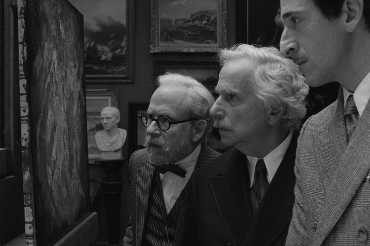 Black-and-white photo from "The French Dispatch" showing Henry Winkler, Bob Balaban and Adrien Brody in character.