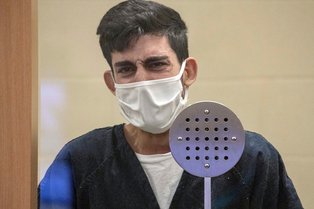 Ali Abulaban, 29, cries during his arraignment.