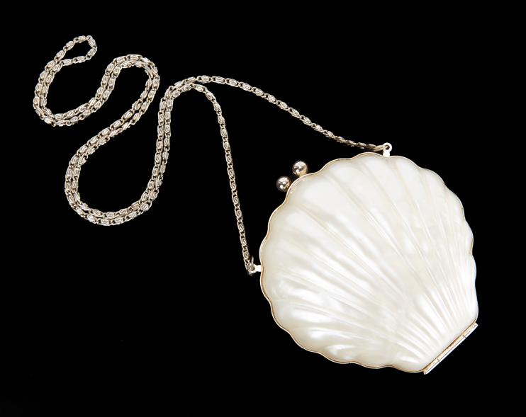 Amy Winehouse's pearlized Reiss seashell clutch available through Julien's auction.