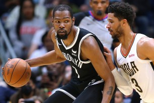 Kevin Durant, who scored 29 points, looks to make a move on Josh Hart during the Nets' win.