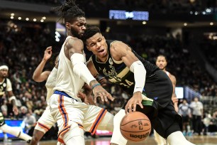 Nerlens Noel, at left, defends Giannis Antetokounmpo.