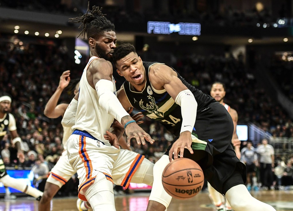 Nerlens Noel, at left, defends Giannis Antetokounmpo.