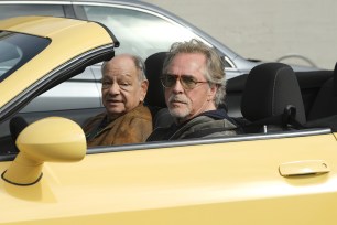 Don Johnson and Cheech Marin sitting in a yellow convertible in a photo for the new "Nash Bridges" movie.