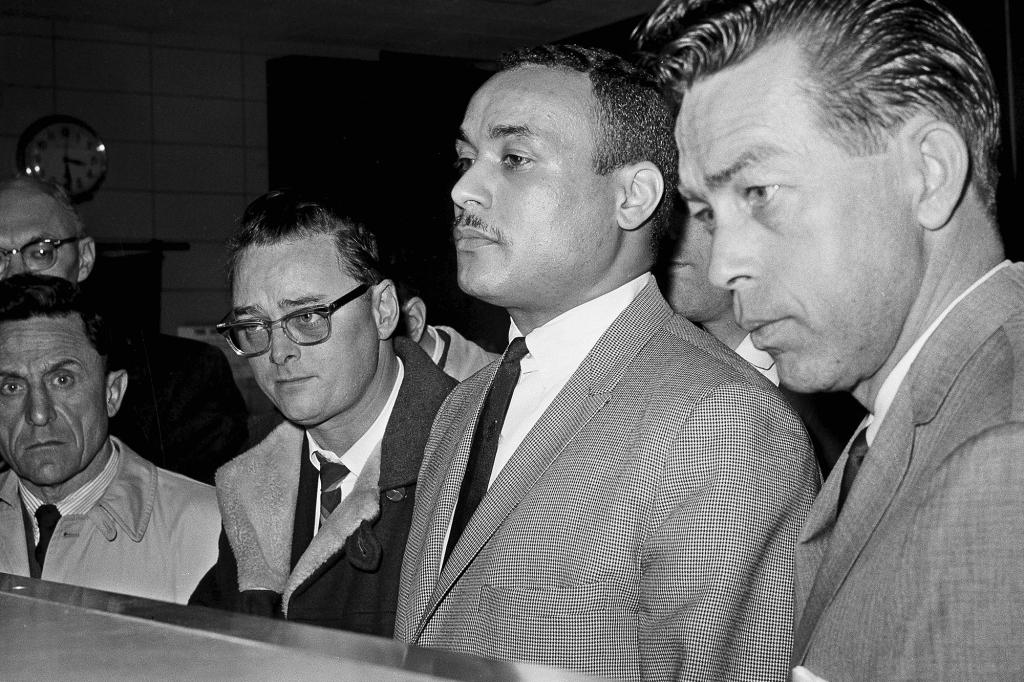 Khalil Islam, then also known as Thomas 15X Johnson, is booked as the third suspect in the slaying of Malcolm X in 1965.