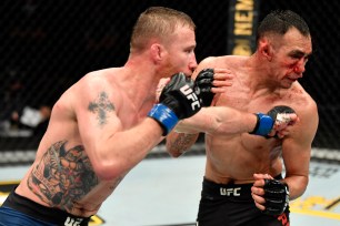 Justin Gaethje (left) lands a punch on Tony Ferguson in his victory for the interim lightweight title on May 9, 2020.