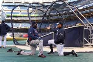 New York Yankees third baseman Alex Rodriguez #13 talks with Boston Red Sox designated hitter David Ortiz #34 during batting practice before a game at Yankee Stadium.