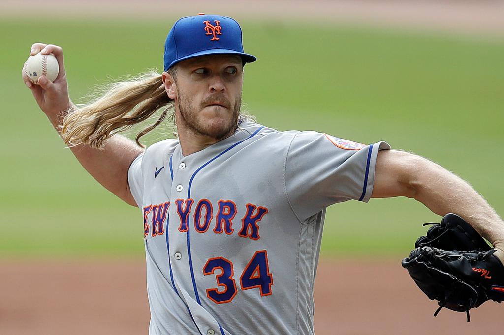 Noah Syndergaard delivers a pitch for the New York Mets during the final game of the 2021 season.