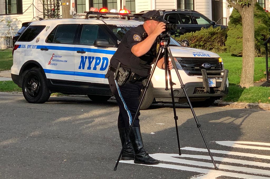 NYPD officers investigate a fatal motorcycle accident at 163 street and 35 Avenue, Queens on October 22, 2021.