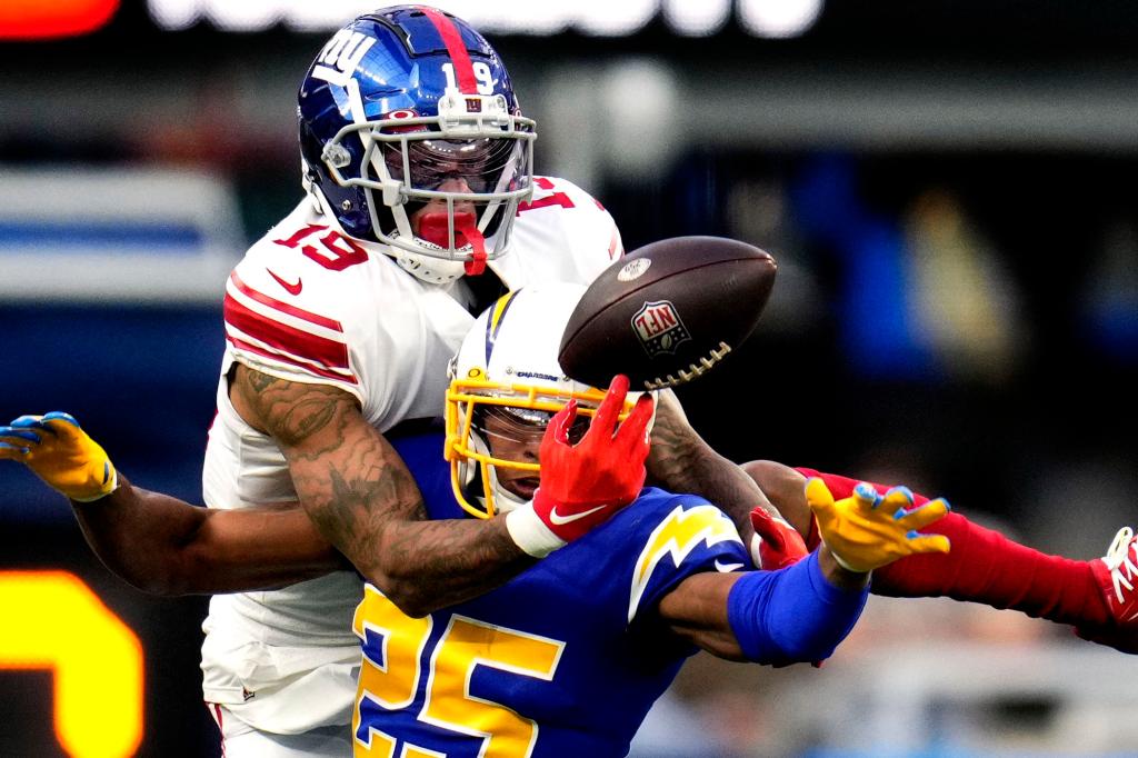 Wide receiver Kenny Golladay #19 of the New York Giants drops a pass in front of cornerback Chris Harris #25 of the Los Angeles Chargers.