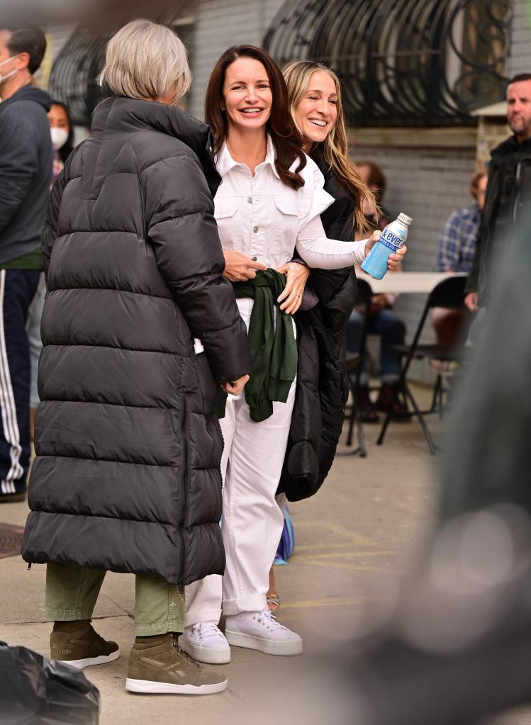 Kristin Davis and Cynthia Nixon (with her back to the camera) are seen filming "And Just Like That..." alongside co-star Sarah Jessica Parker in New York City last month.