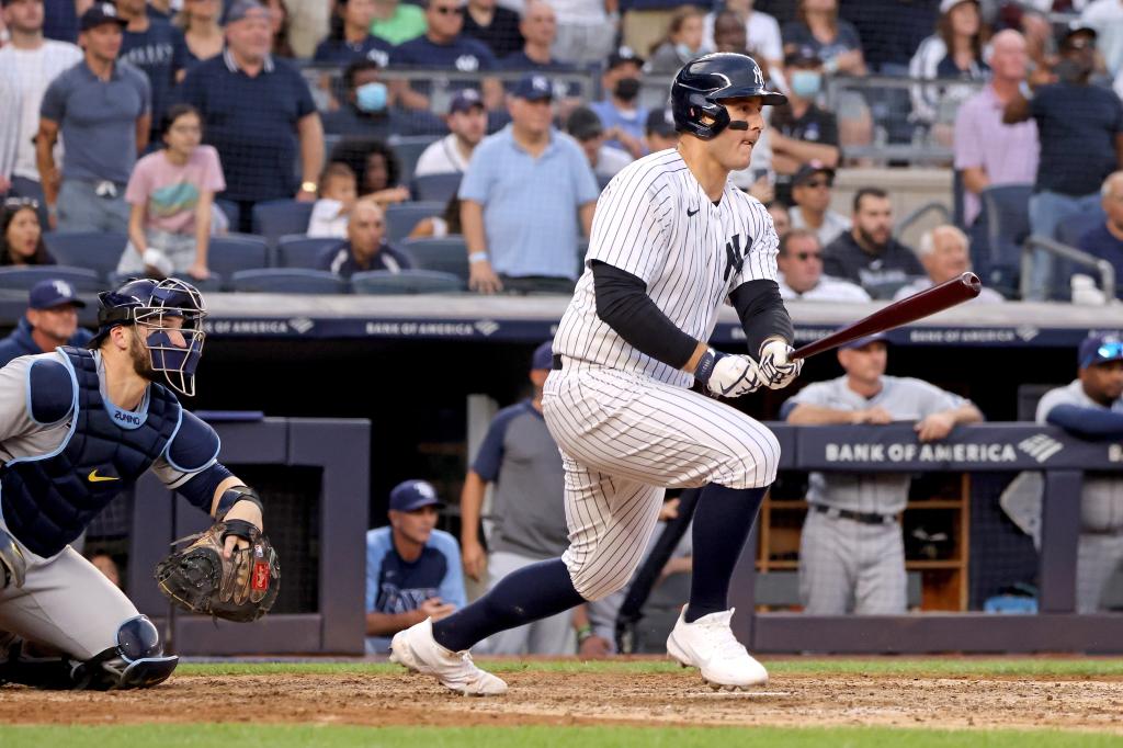 Anthony Rizzo #48 of the New York Yankees follows through on a base hit.