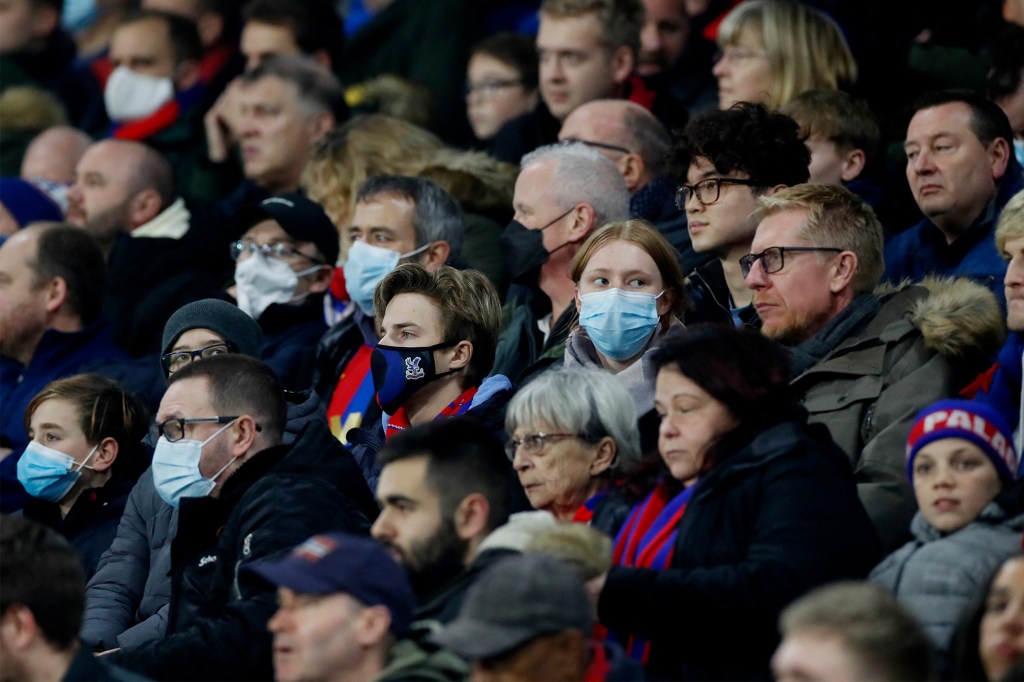 A crowd of masked and unmasked people attending a soccer game in London on December 15, 2021.