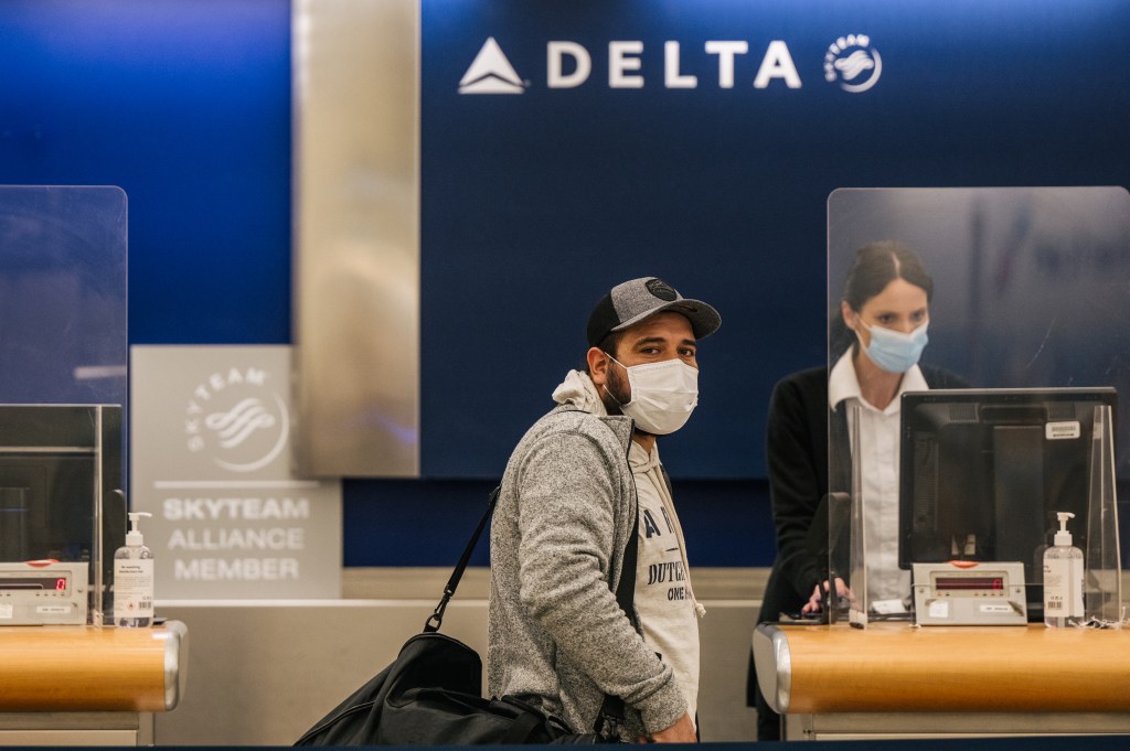 A person checks in for their departure flight at the George Bush Intercontinental Airport.