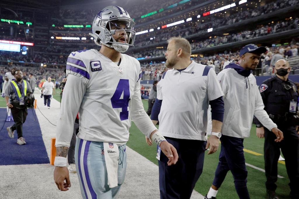 Dak Prescott walks off the field.