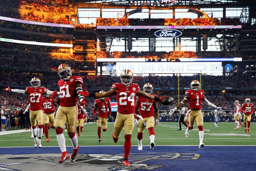 K'Waun Williams (24) celebrates with teammates after intercepting Dak Prescott.