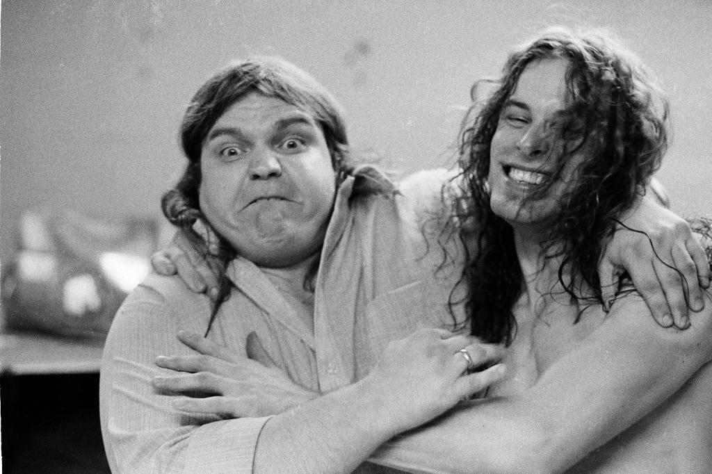 Meat Loaf embraces friend and collaborator Ted Nugent backstage at a concert in 1979.