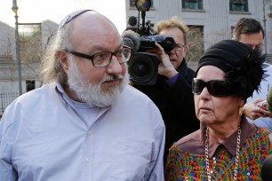 Convicted spy Jonathan Pollard and his wife, Esther, leave the federal courthouse in New York, Nov. 20, 2015.