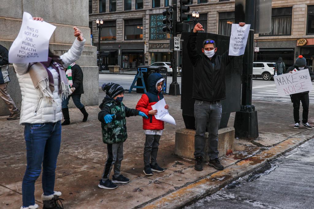 A Chicago family stands out protesting against school closing.