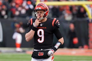 Joe Burrow #9 of the Cincinnati Bengals warms up before the AFC playoff game