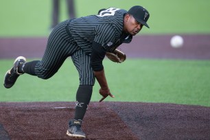 Vanderbilt's Kumar Rocker (80) pitches