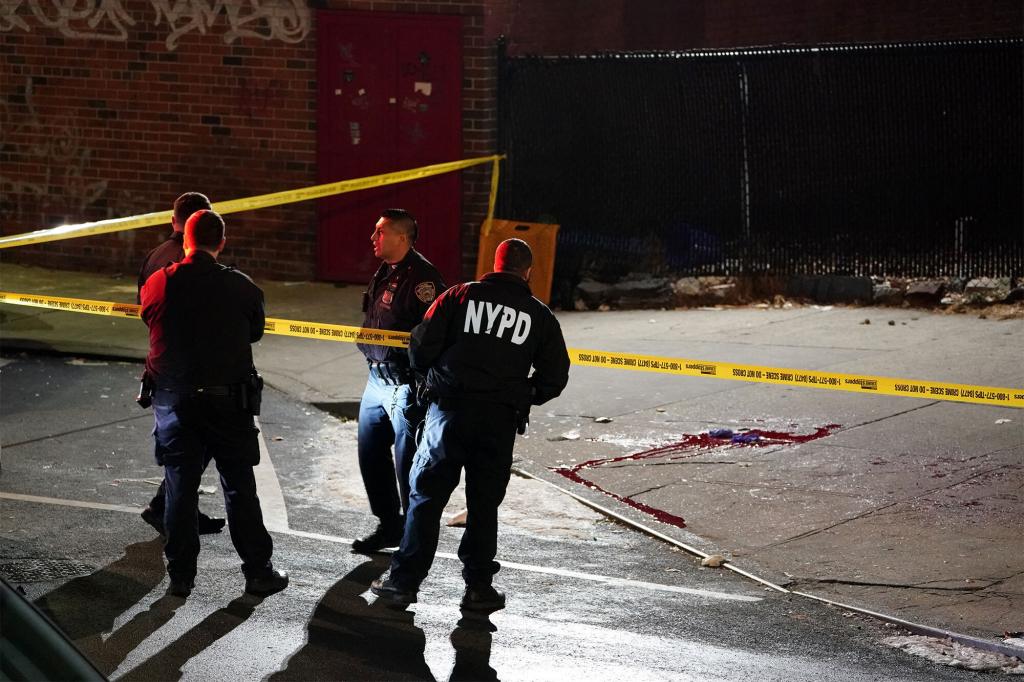 Police at the scene where a person was possibly fatally stabbed on W132nd Street near Lenox Avenue in New York, NY around 9:45 p.m. on January 13, 2022.