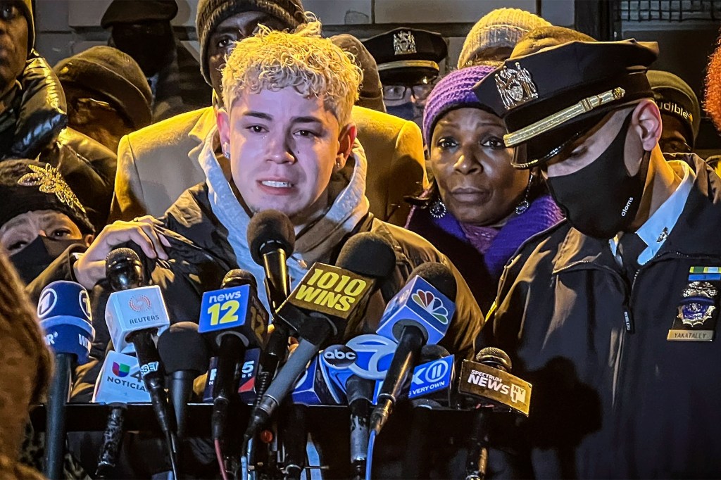 NYPD Officer Sterling Medina (center) remembers Officers Jason Rivera and Wilbert Mora during a vigil outside of the 32nd precinct in Harlem on Jan. 26, 2022.