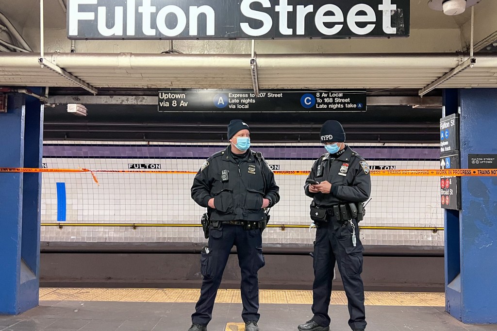 Police officers at the scene of where a man was pushed onto the subway track at Fulton Street Station in Manhattan on January 23, 2022.
