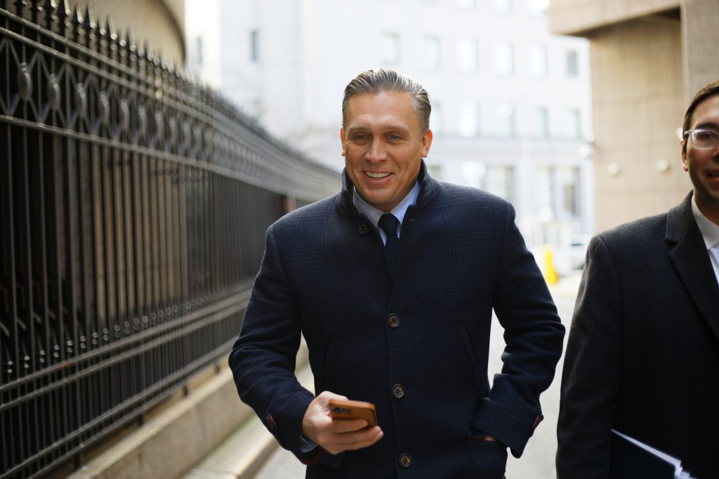 Archer smiles as he leaves the courthouse.