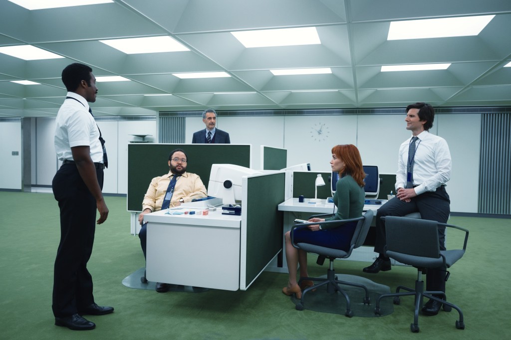 Tramell Tillman, Zach Cherry, John Turturro, Britt Lower and Adam Scott stand in an office in “Severance."