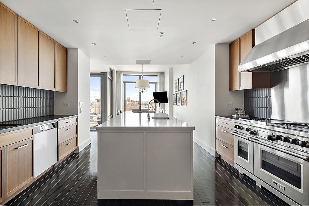 Jon Bon Jovi's luxurious spot features a large adjoining eat-in kitchen fully equipped with appliances, according to the property listing on Compass.