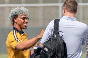 A smiling Francisco Lindor talks with new Mets teammate Max Scherzer before the day's baseball labor negotiations that went nowhere again.