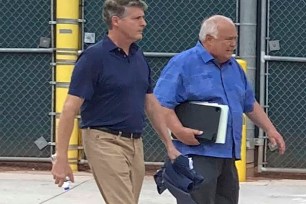 Yankees managing general partner Hal Steinbrenner talks with Padres vice chairman Ron Fowler during MLB labor talks at Roger Dean Stadium in Jupiter, Fla.