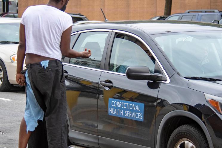 A homeless man approaches a Correctional Health Services vehicle in the Bronx on October 9th, 2018.