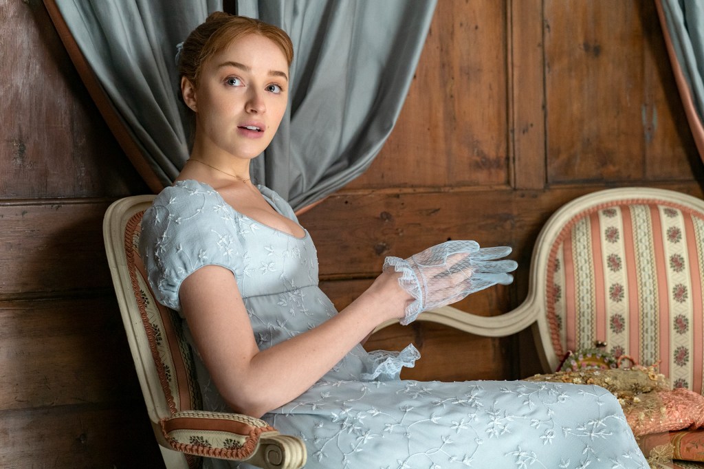 Phoebe Dynevor as Daphne Bridgerton in a blue dress and lace gloves