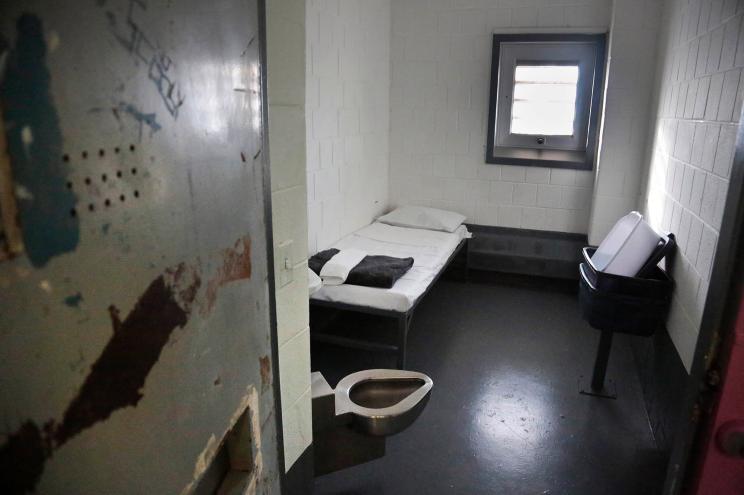 the interior of a solitary confinement cell at New York's Rikers Island jail is shown.