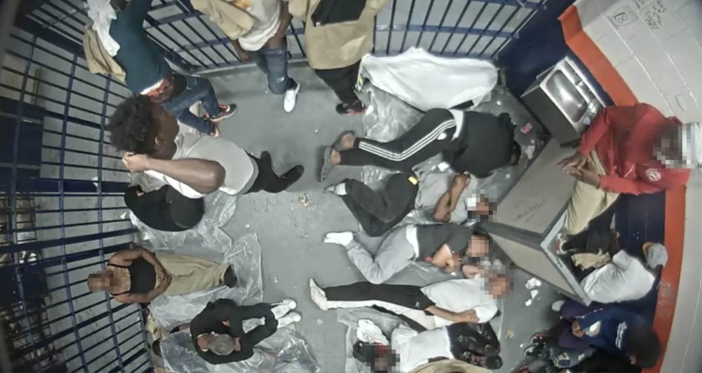 Rikers Island inmates crammed into small cell.