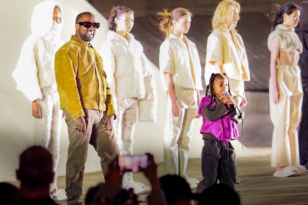 Kanye West and daughter North West attend the "Yeezy Season 8" at Paris Fashion Week in March 2020.