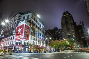 A shot of Macy's flagship store lit up at night in Manhattan