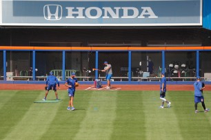 The Mets staff using right field for fielding drills at Citi Field