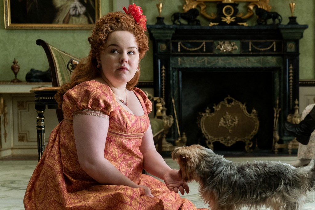 Nicola Coughlan as Penelope Featherington in a orange dress