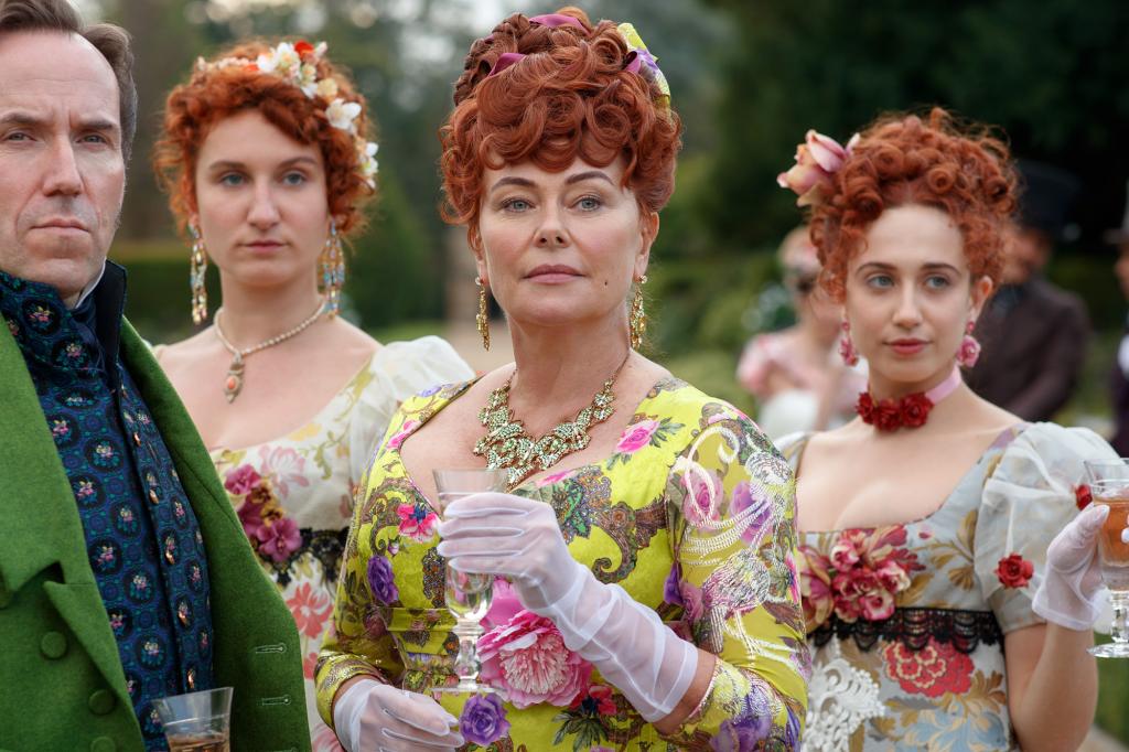 Polly Walker in a yellow dress as Portia Featherington