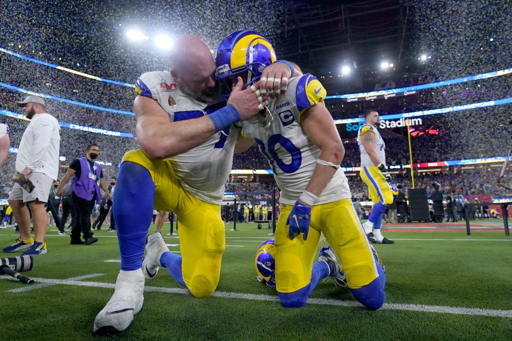 Los Angeles Rams offensive tackle Andrew Whitworth, left, celebrates with wide receiver Cooper Kupp (10) after the Rams defeated the Cincinnati Bengals in the NFL Super Bowl 56.