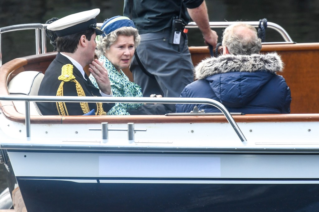 MACDUFF, SCOTLAND - AUGUST 02: Imelda Staunton and other cast members are seen on a boat made to look like a Royal yacht tender in the harbour during filming for the Netflix series "The Crown" on August 2, 2021 in Macduff, Scotland. Actors including Imelda Staunton were seen in the Scottish fishing village as they recreated scenes from when HRH Queen Elizabeth visited the town in 1961. (Photo by Peter Summers/Getty Images)