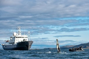 A EYOS ship plies Greenland's waters.