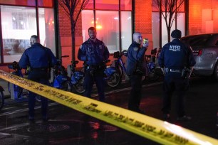 NYPD officers investigate the scene of a shooting on 54 King St. in Hudson Square in Lower Manhattan.