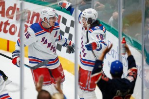 Artemi Panarin (right), who also had four assists, accepts congratulations from Ryan Strome after scoring a goal in the first period of the Rangers' 7-4 win over the Stars.